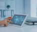 Healthcare professional using a tablet for patient data, relevant to 99214 CPT code documentation.